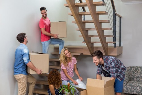 Professional team packing office equipment for removal