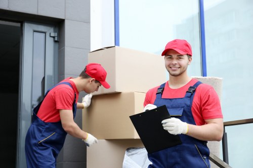 Crew sorting office furniture for reuse at removal site
