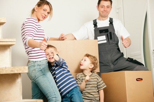 Professional movers handling office furniture