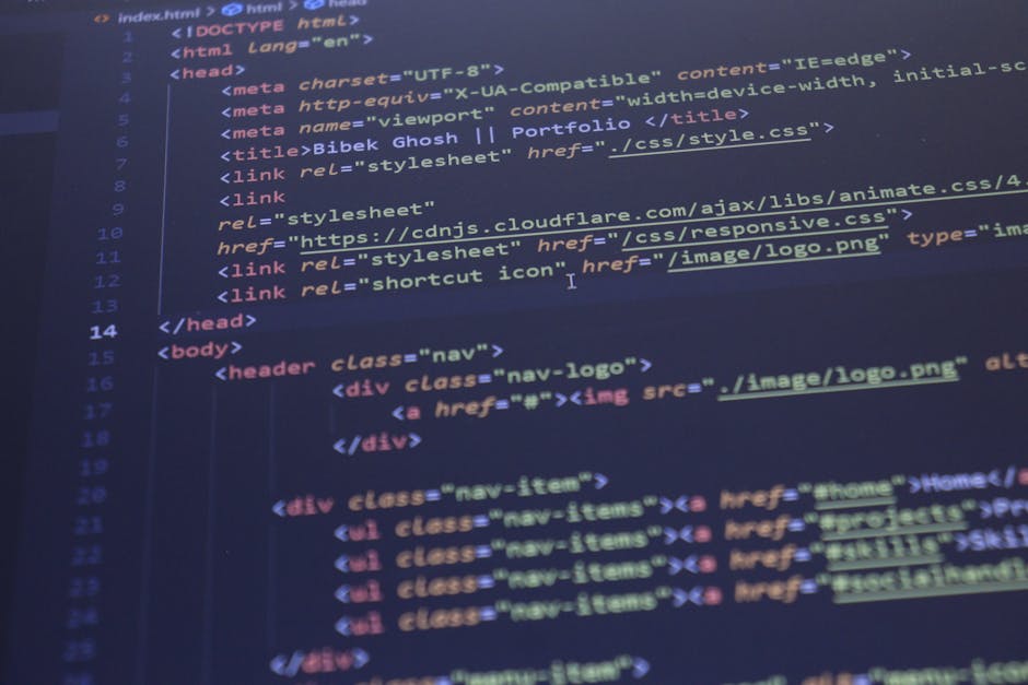 Photograph of a computer screen displaying HTML code with colorful syntax highlighting in shades of red, yellow, green, and pink on a dark background. The code includes various tags such as <ul>, <li>